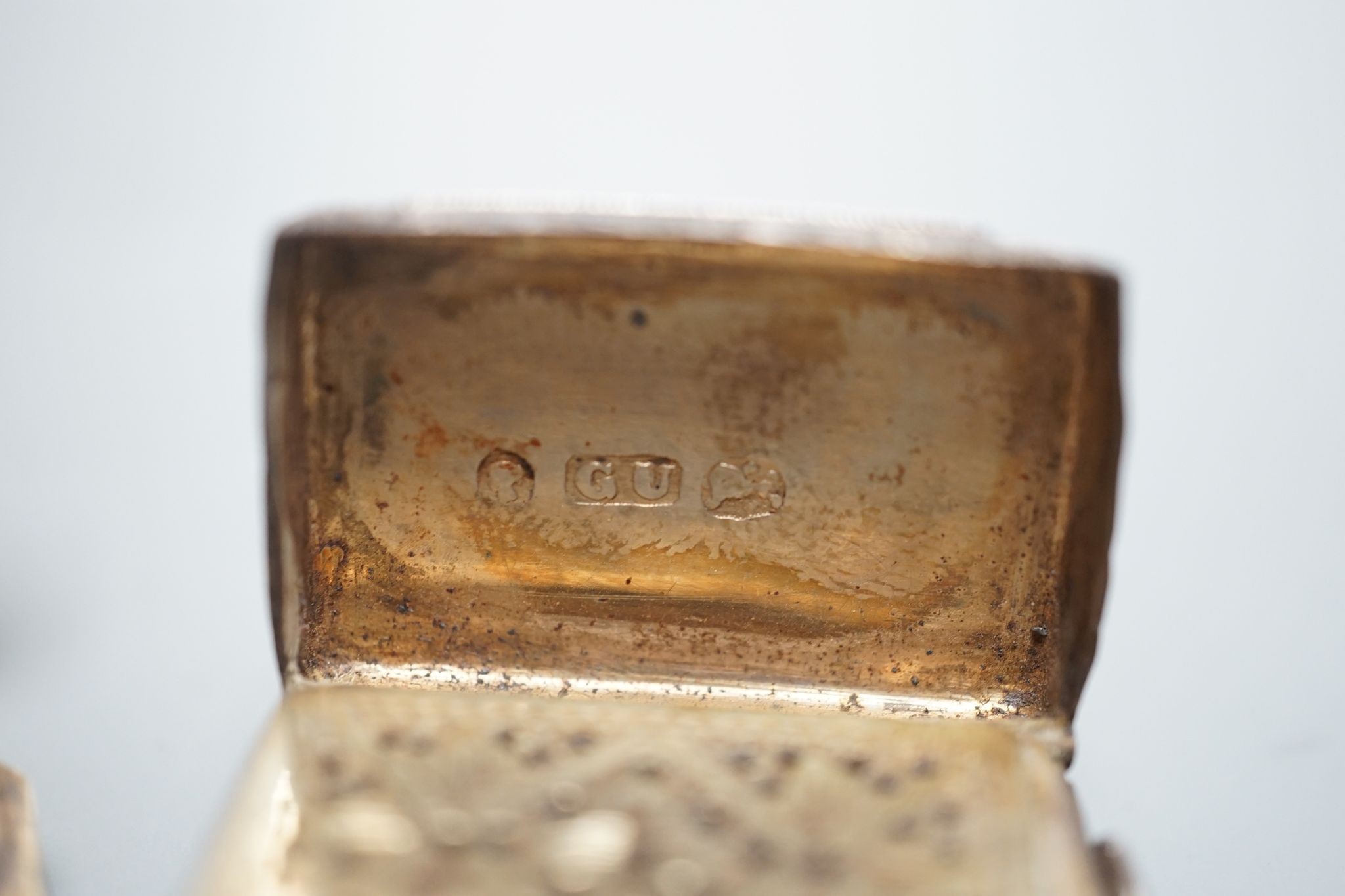 An Edwardian silver octagonal vinaigrette, with engraved sunburst decoration, maker, B.C Birmingham, 1906, 51mm and a smaller earlier vinaigrette by George Unite.